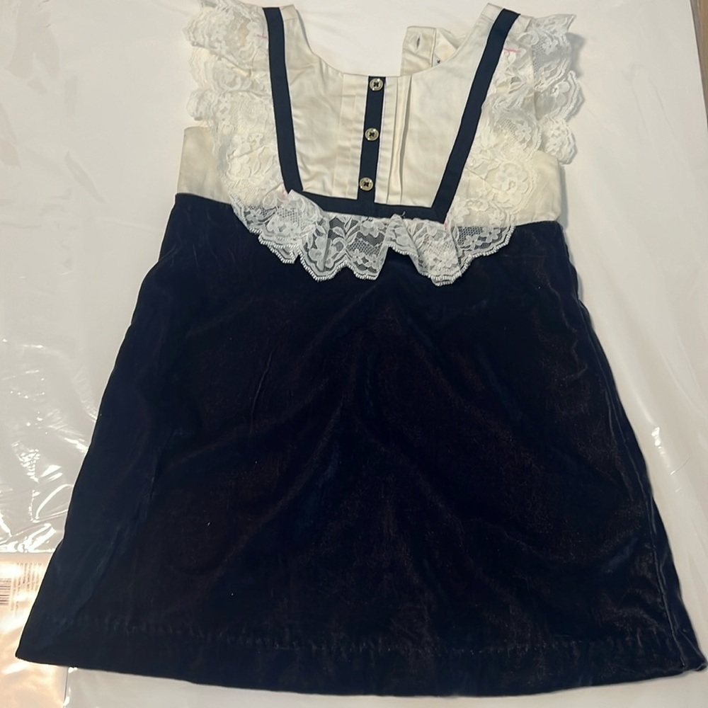 New dress. Janie and Jack. Came with red marks on it. Never worn